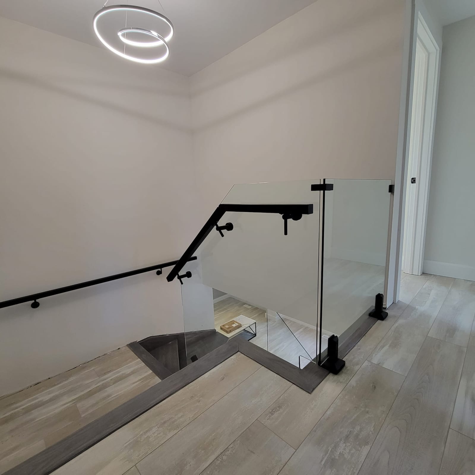 Frameless glass staircase railing with wood treads — Built By Glass