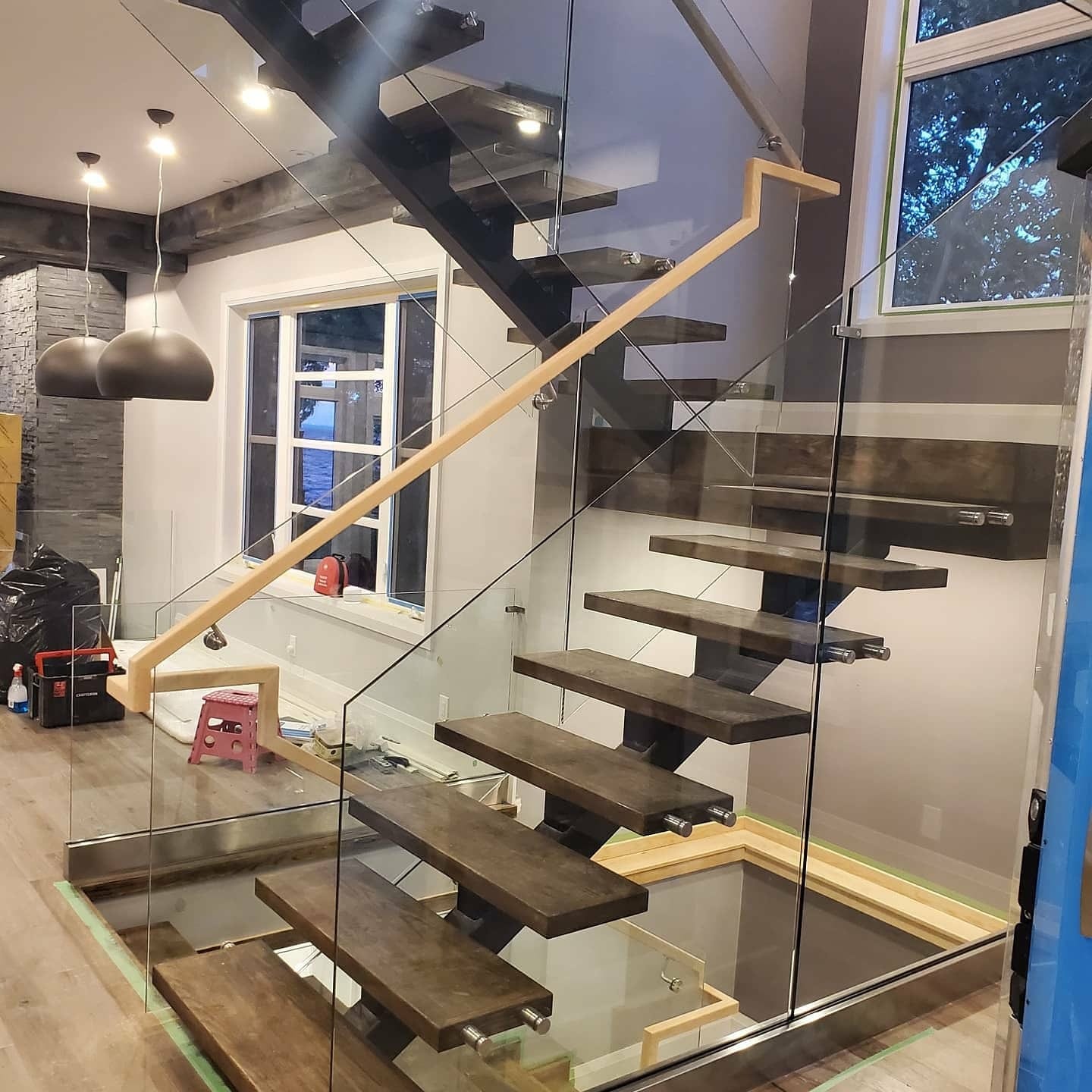 Frameless glass staircase railing with wood treads — Built By Glass