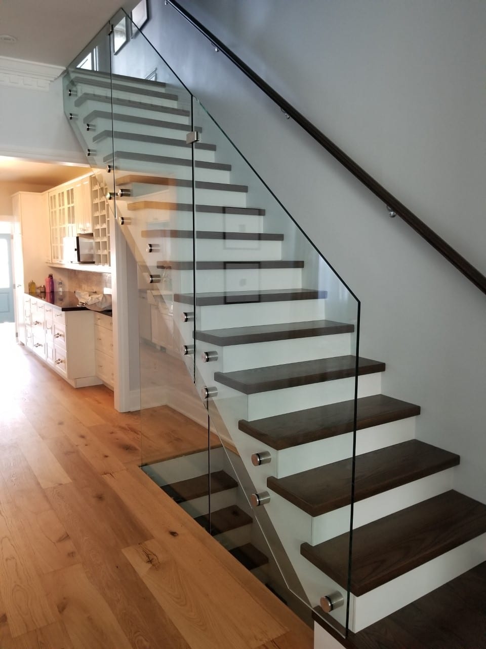 Frameless glass staircase railing with wood treads — Built By Glass