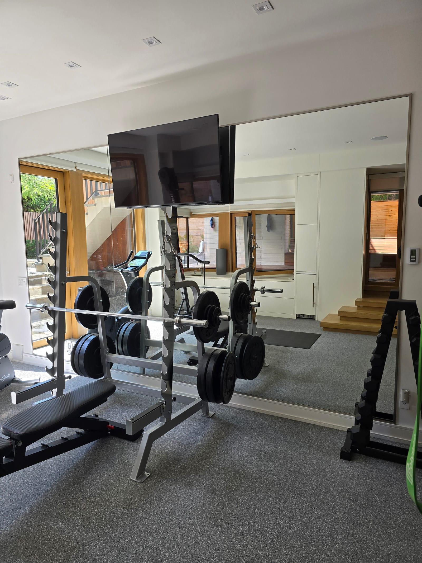 Home gym wall mirrors in an exercise room — Built By Glass, Toronto