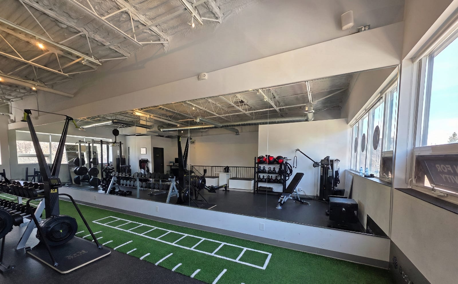 Large commercial gym mirror wall — Built By Glass, Toronto