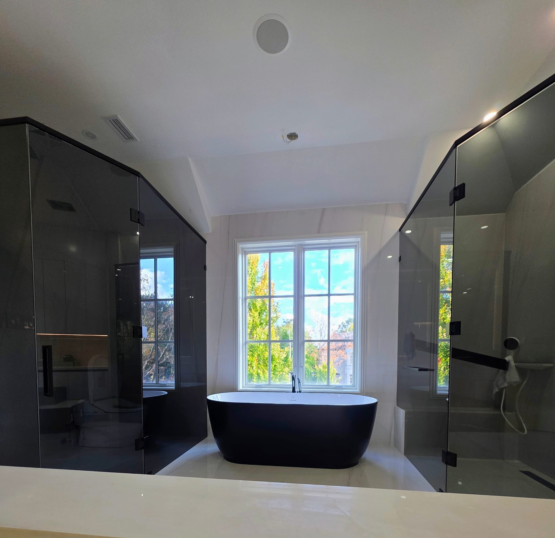 Frameless glass shower installation in modern bathroom — Built By Glass, Toronto GTA